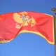 Montenegro Flag Flying in the Background of the Sky - VideoHive Item for Sale