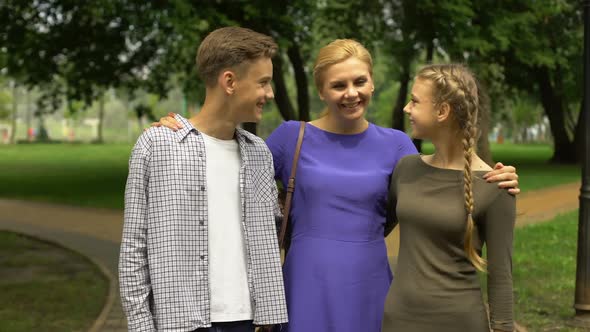 Cheerful Mother Admiring Her Children, Proud of Smart and Intelligent Kids