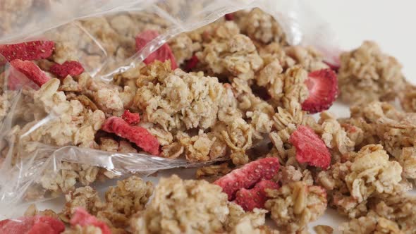 Package of crunchy cereals slow tilt 4K 2160p 30fps UltraHD  footage - Tasty muesli with dehydrated 