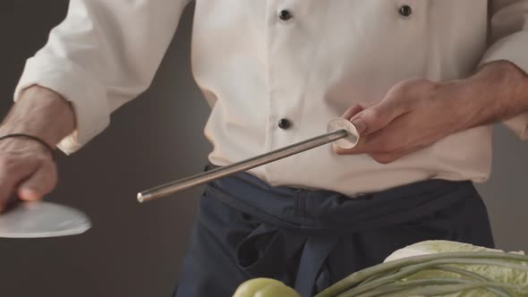 Professional Cooker Preparing an Instrument for Work