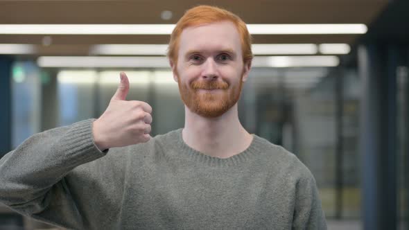 Portrait of Young Man Showing Thumbs Up Sign