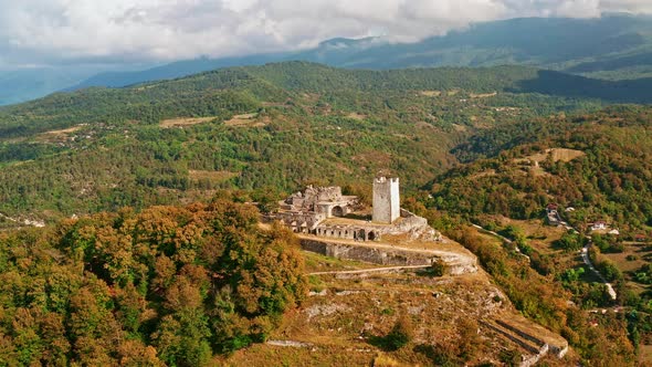 Aerial View of the Old Fortress in Mountains on Sea Coast. Panorama From Height To the Ruins