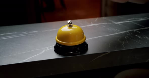 A Woman Hand Presses Bell Button