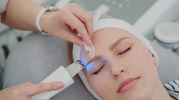 Close-up Shot of Cosmetician Making Cavitation Facial Peeling