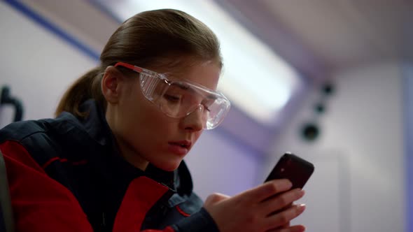 Paramedic Ambulance Texting Message on Mobile Phone in Emergency Car