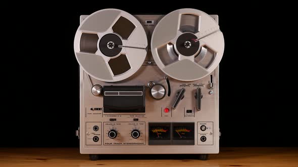 Vintage Reel to Reel tape recorder playing music