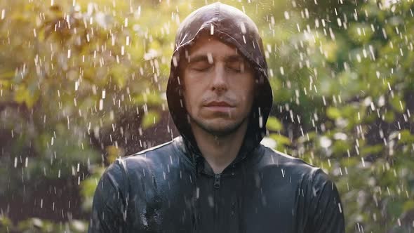 Man Stands in the Rain