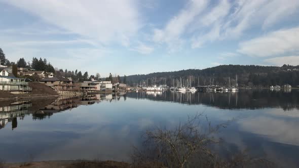 Postcard picture reflection of the landscape surrounding Gig Harbor Washington, aerial lift, and dol