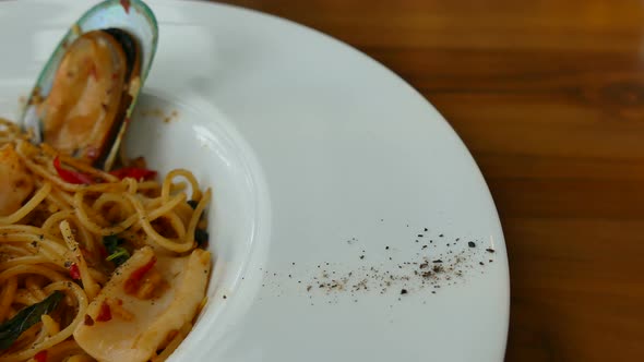 Spaghetti spicy seafood in white plate