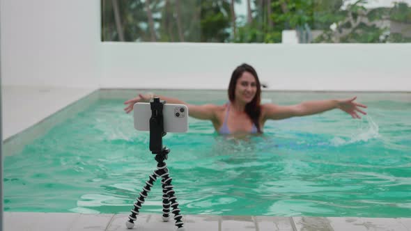 Young Girl Blogger Record at Camera for Social Media Content Using Phone on Tripod Outdoor Close Up