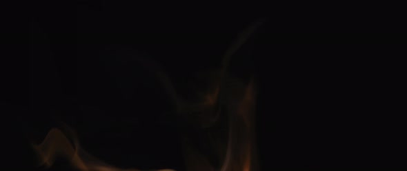 Fiery incense smoke swirling on black background alt