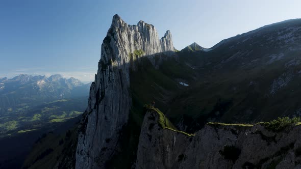 Aerial view of a person hiking on the mountain top, Wasserauen, Switzerland. alt