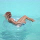 Woman Relaxing in Swimming Pool Lounging on Rubber Ring - VideoHive Item for Sale
