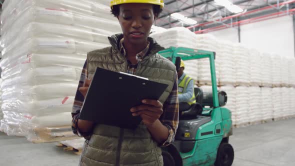 Young female worker in a warehouse