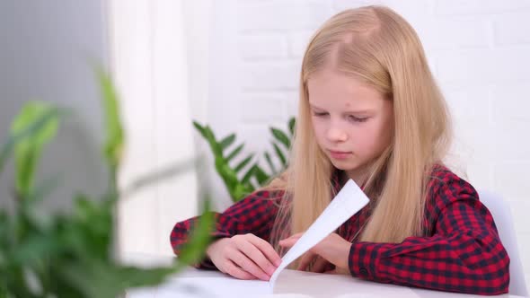 Blonde Schoolgirl Studying at Home Doing School Homework