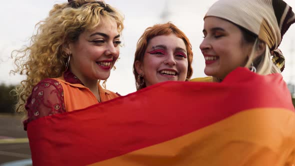 Happy young girls celebrating gay pride festival - LGBT community concept