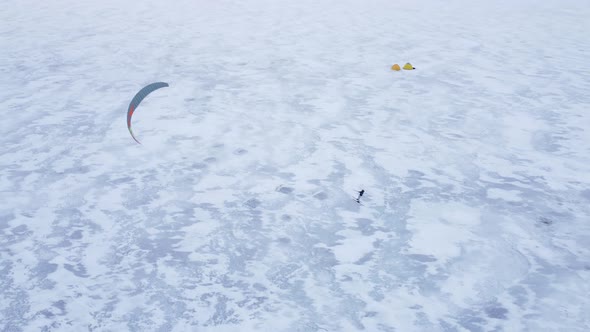 SnowKiting Kitesurfing Sport on the Ice Lake Winter