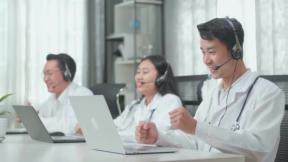 Success Three Asian Doctors With Stethoscopes Wearing Headset Working As Call Centre Agents