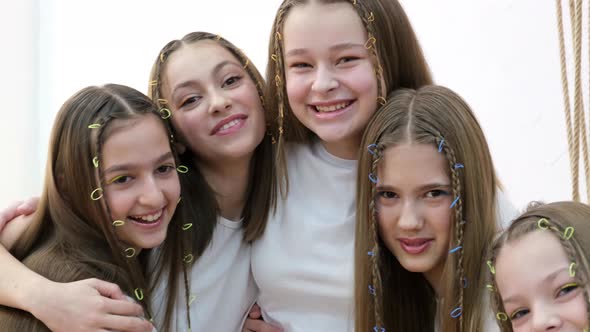 Five Happy Beautiful Teenage Girls Posing for the Camera