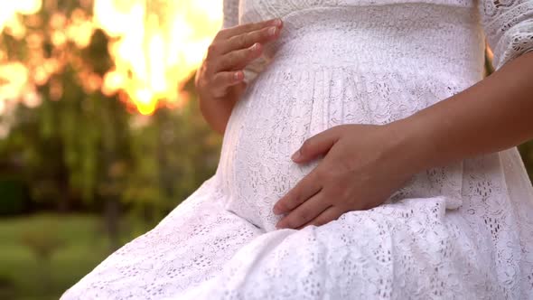 Pregnant Woman Feeling Happy at Garden Home