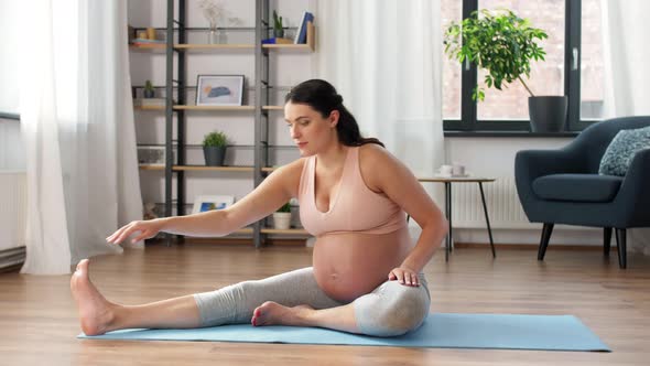 Happy Pregnant Woman Doing Sports at Home