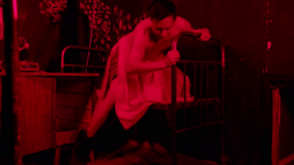 Mentally Unstable Half Naked Man Going Crazy in Hospital Room with Red Lighting