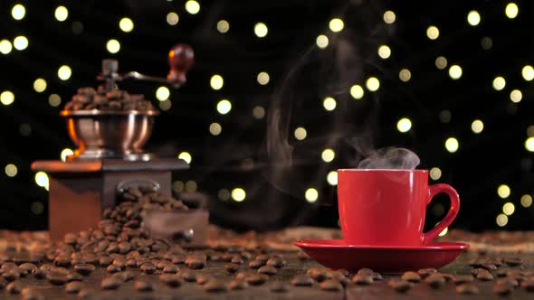 Red Cup of Hot Coffee with Smoke. Background with Lights