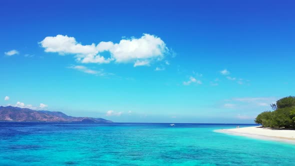 Aerial drone view seascape of marine seashore beach wildlife by blue green sea with white sandy back