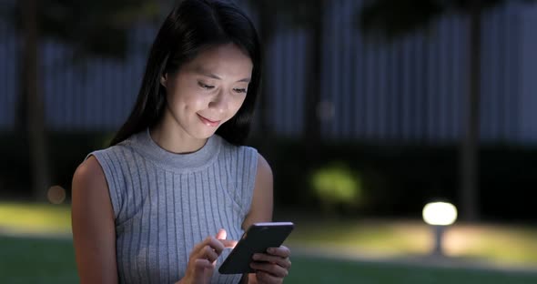 Woman use of mobile phone at outdoor