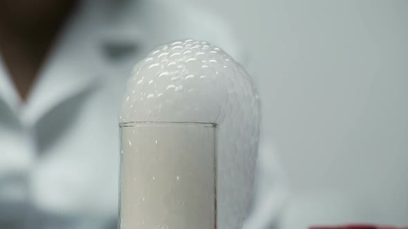 Thick Bubble Foam Coming Out of Neck of Chemical Flask, Cosmetology Research