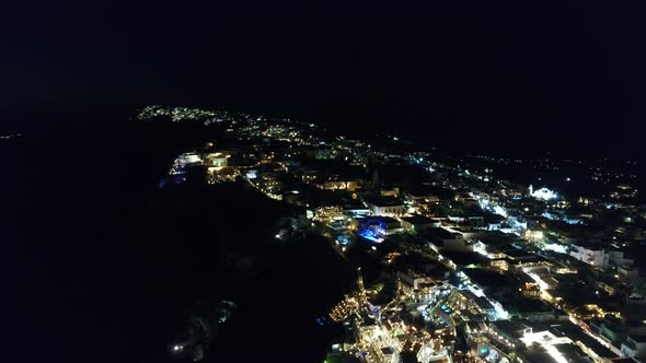 City of Santorini by night on the island of Santorini in Greece from the sky