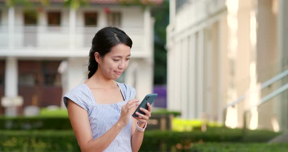 Woman use of mobile phone at outdoor