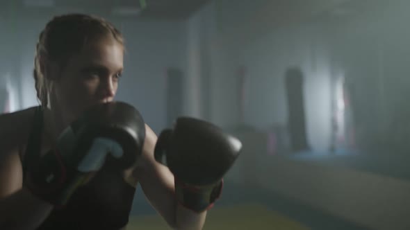 Woman Power Female Fighter Trains His Punches Beats a Punching Bag Training Day in the Boxing Gym