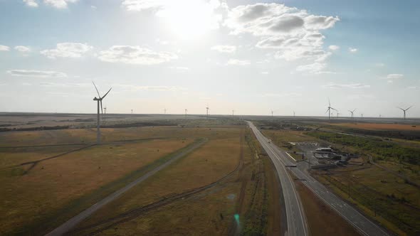 Aerial View of Wind Turbine on a Field in a Summer Day. Environment Friendly and Renewable Energy