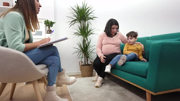 Pregnant Mother with Her Son at Child Psychologist's Office