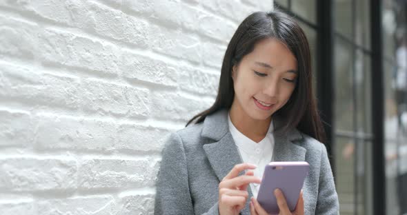 Businesswoman Using Mobile Phone