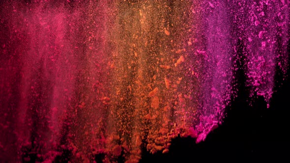 Super Slowmotion Shot of Color Powder Waterfall Isolated on Black Background