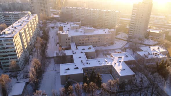 School and Kindergarten Buildings in City Block in Winter