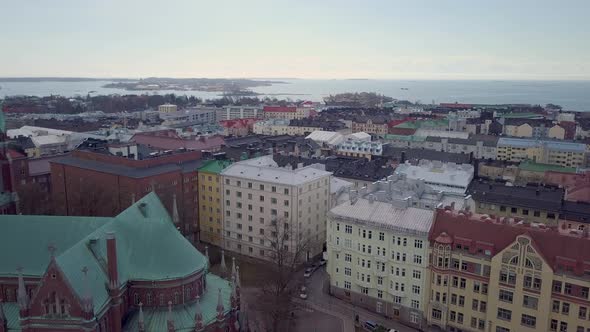 Aerial Push past Old Church. Aerial shot of St. John's Church, Johanneksenkirkko, & Finnish Neighbor