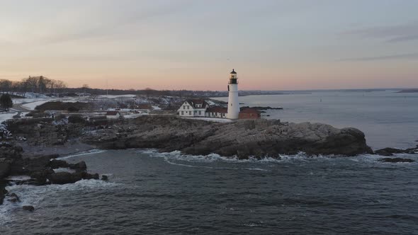 Slow AERIAL Orbit of Cape Elizabeth Lighthouse during winter sunset