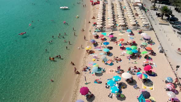 Aerial Overhead View of Lined Beach Umbrellas on a Tropical Beach