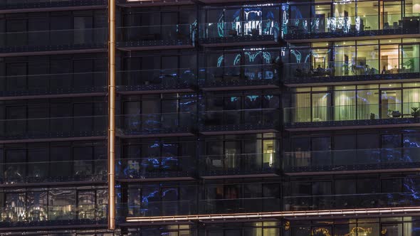 Flat Night Panorama of Multicolor Light in Windows of Multistory Buildings Aerial Timelapse