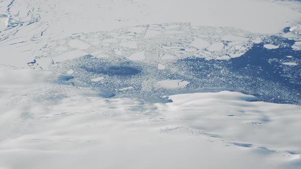 Icy Coastline And Blue Ocean Of Greenland