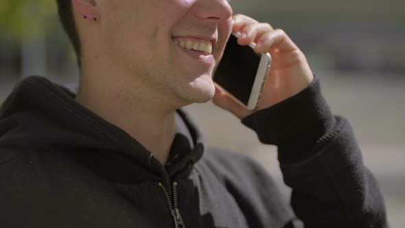 Cropped Shot of Happy Man Talking By Mobile Phone