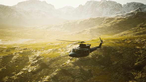 Slow Motion Vietnam War Era Helicopter in Mountains alt