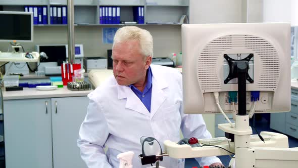 Male Scientist Looks To the Side at the Laboratory