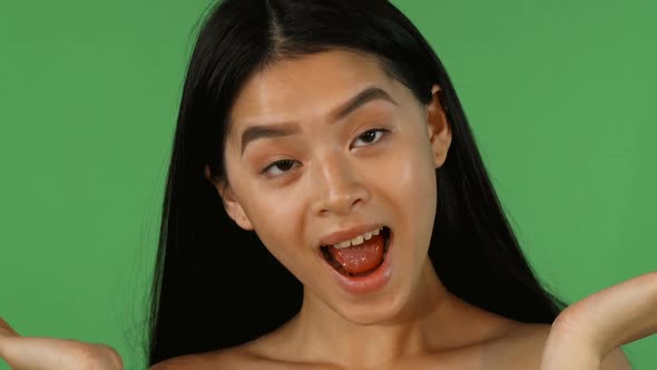 Cheerful Asian Woman Showing Different Emotions at Studio 1080p