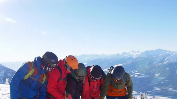 Skiers with ski interacting on snowy landscape