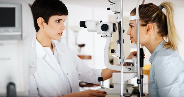 Patient or Customer at Slit Lamp at Optometrist or Optician