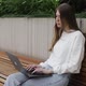 Young Female in Garden Using Laptop Communicates on Internet with Customer - VideoHive Item for Sale